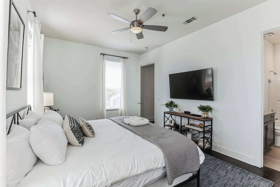 The king suite boasts an ensuite bath, smart TV, ample natural light