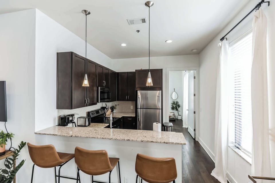 Sip morning coffee or grab a bite at the kitchen counter, seating 3
