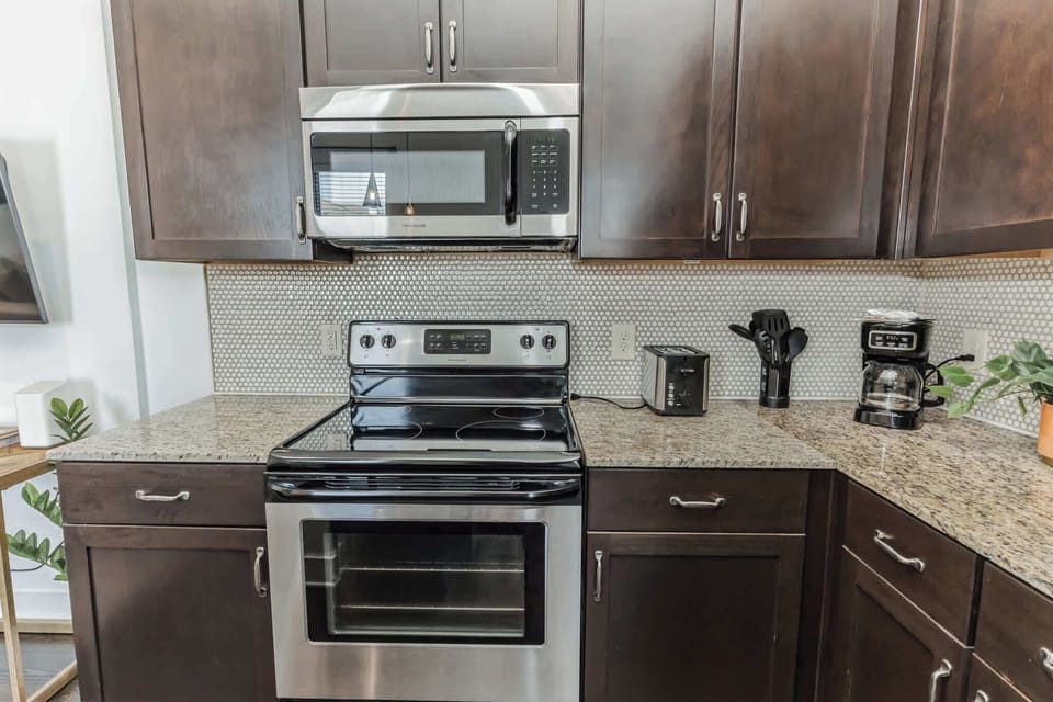 The open, airy kitchen offers ample space & every home comfort