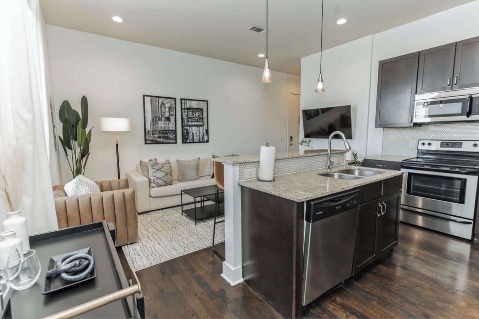 The open, airy kitchen offers ample space & every home comfort