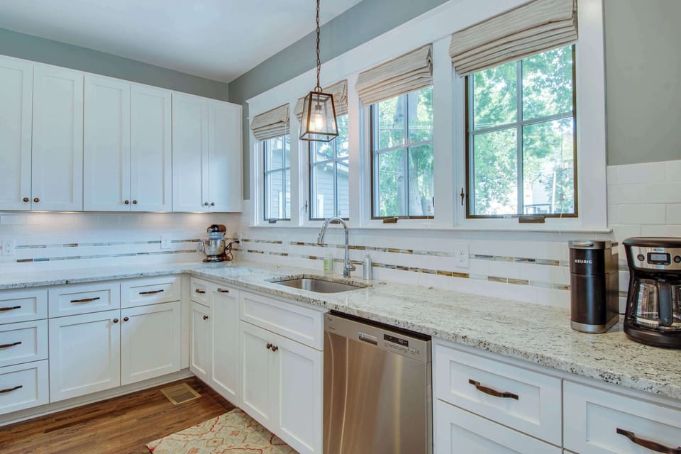 Kitchen with drip coffee maker, toaster, blender, stand mixer, and more