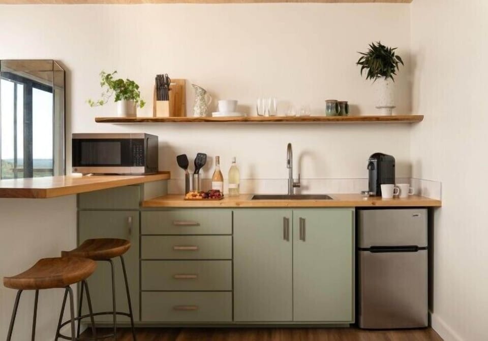 Espresso maker, mini-fridge, stovetop, electric kettle