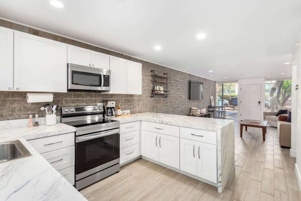 Full kitchen includes all the essentials and is complemented by a cozy dining area.