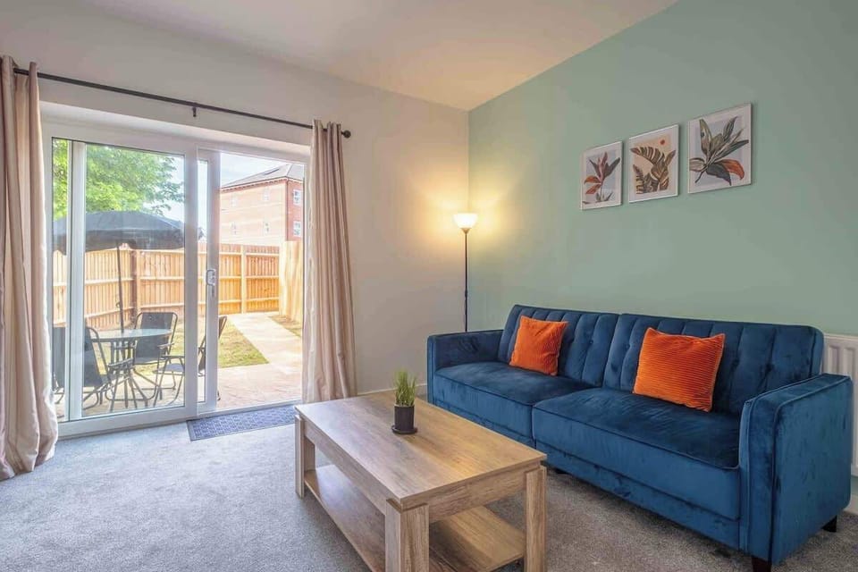 Sink into comfort on the inviting sofa and armchair, offering a welcoming space to watch movies or catch up on your favorite series