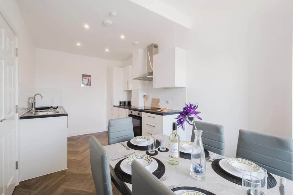 Enjoy shared meals and conversations at the elegant dining table, featuring seating for six