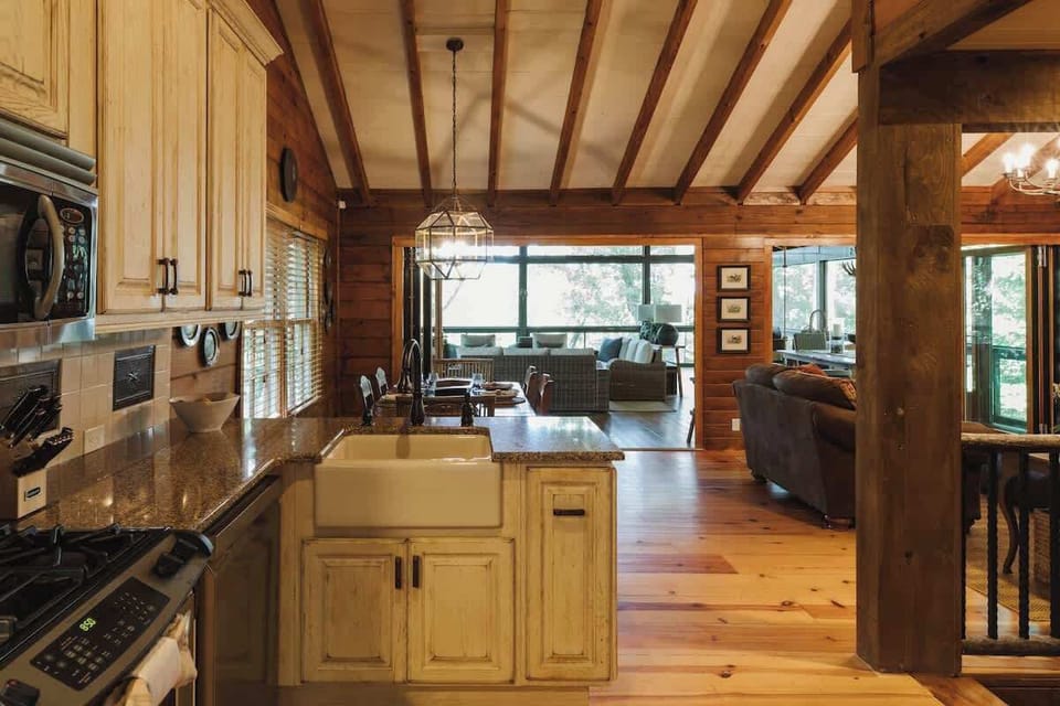 The open design ensures that even while you're preparing meals in the kitchen, you can stay connected with family and friends gathered around the dining table, screened-in porch and living room.  