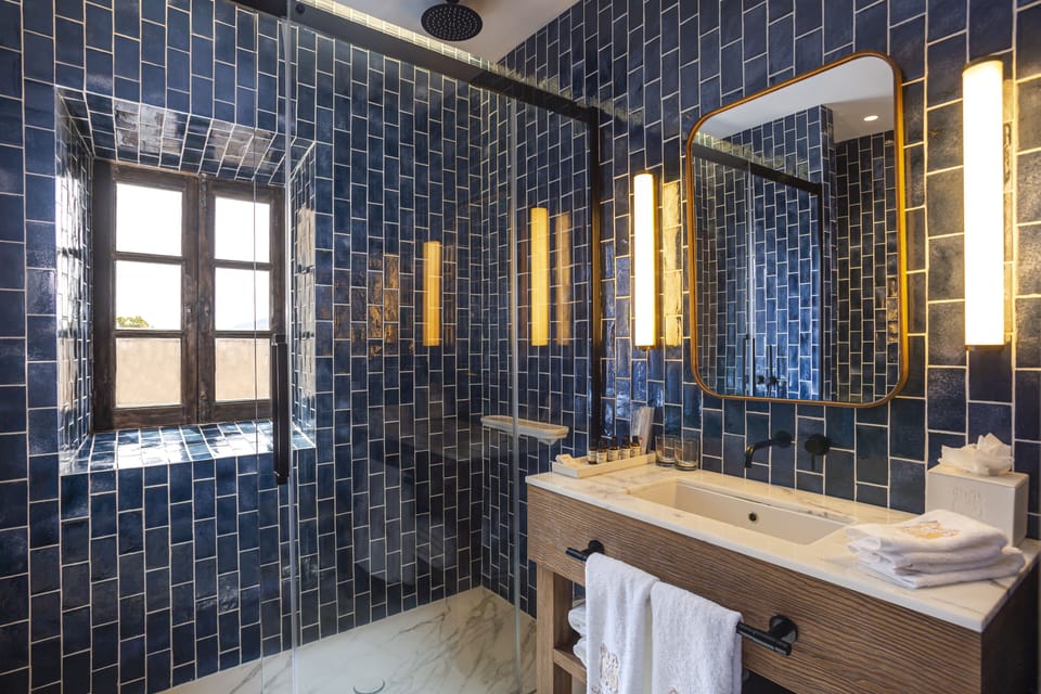 Suite, Balcony, Sea View | Bathroom | Shower, rainfall showerhead, designer toiletries, hair dryer
