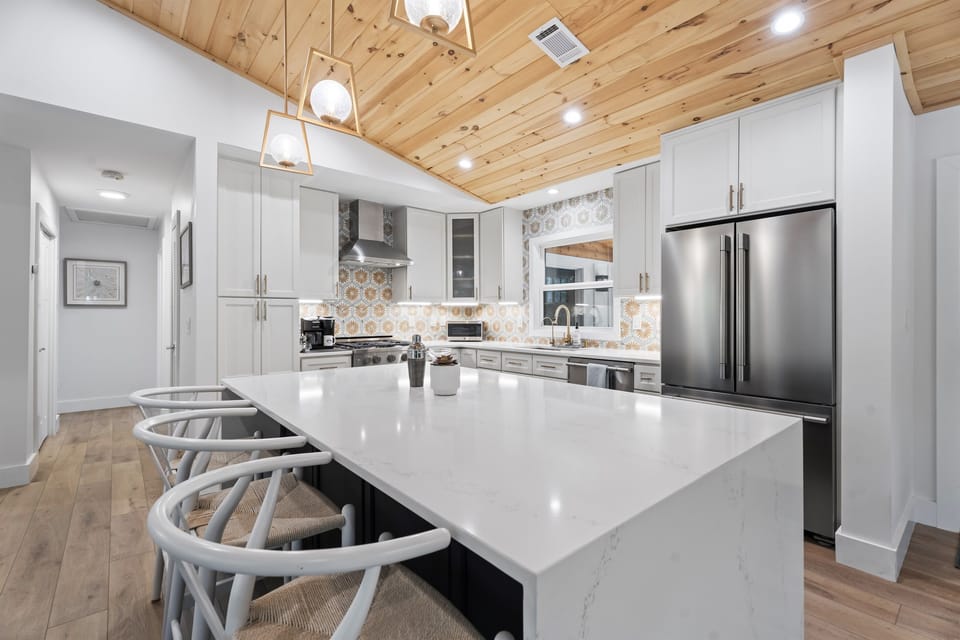 Large kitchen island for food prep and entertaining.