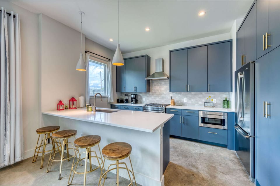 Kitchen with drip coffee maker, toaster, blender, dishwasher, and more