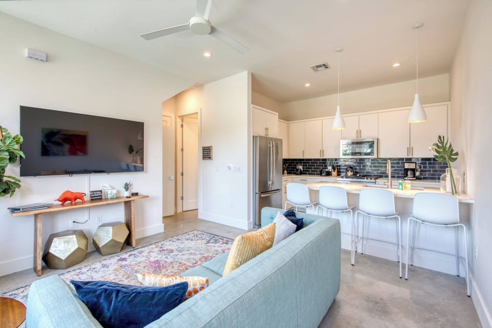 Unit B Living room with couch and flat screen TV