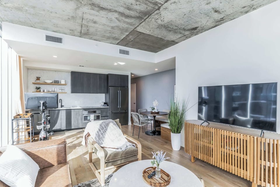 Bright living space with Smart TV, and sofa sleeper