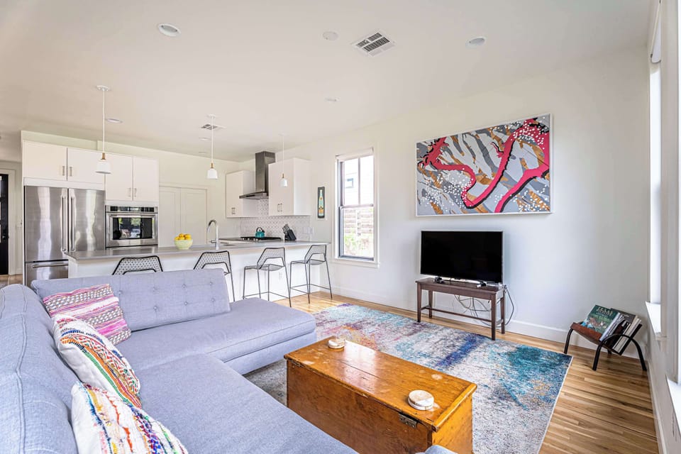 Cozy and spacious living area with TV