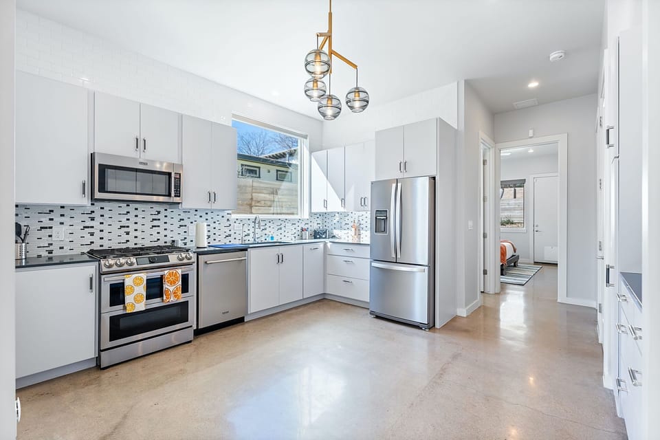 The kitchen is a chef’s dream, offering ample space & every home comfort