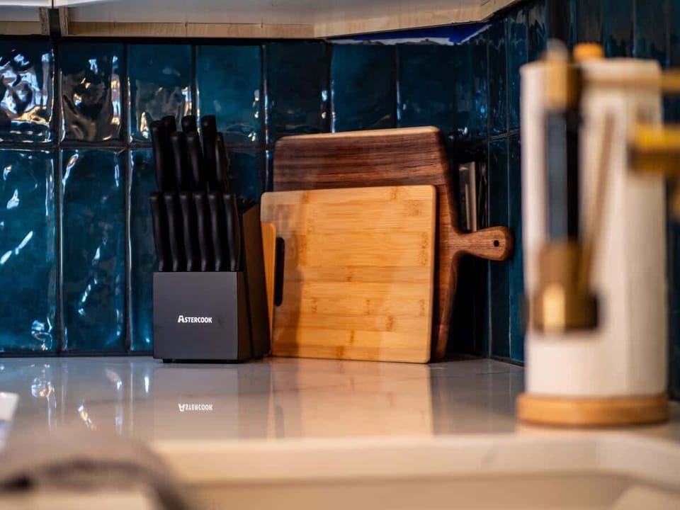 Kitchen detail w/ knife set & wood accents for a chef-ready feel