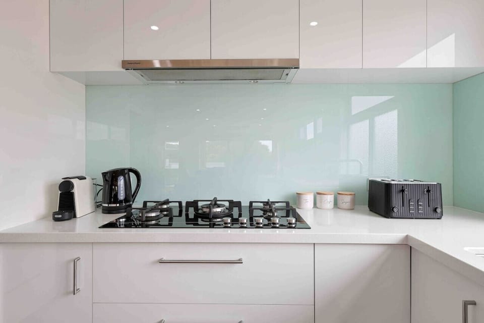 Modern kitchen with gas cooktop and sleek finishes