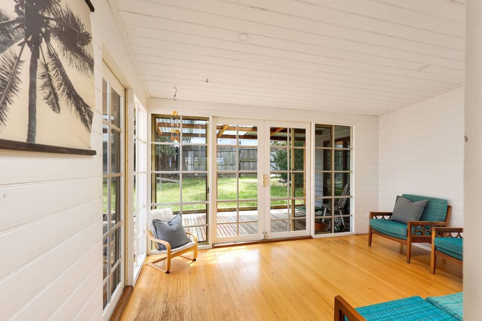 ☀️ Sunroom / Deck Access Light-filled space opening to outdoor deck.
