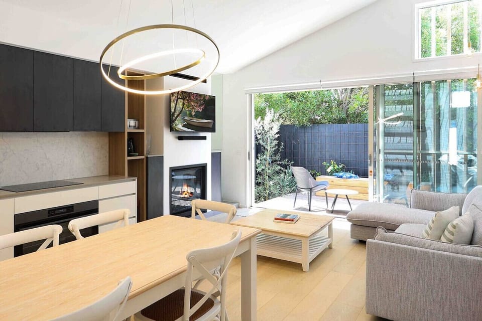 Spacious living area with fireplace and outdoor access