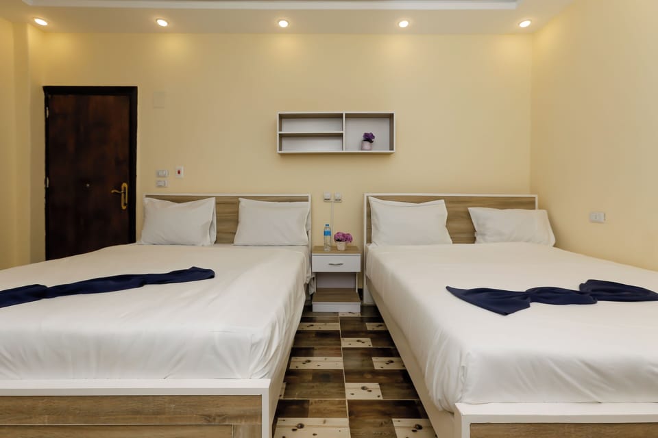 Economy Quadruple Room | Premium bedding, down comforters, Select Comfort beds, desk
