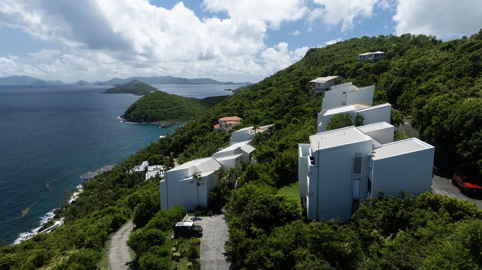 Nestled between lush greenery and the endless ocean, this property is a true escape.