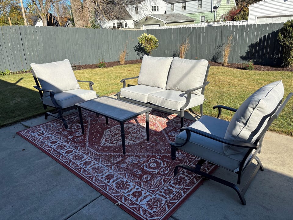 Backyard-New patio, outdoor furniture, dining table, and Weber grill