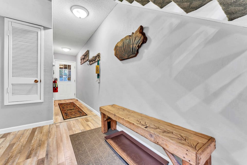 Entryway: Bench, coat hooks, entryway opens to main living space
