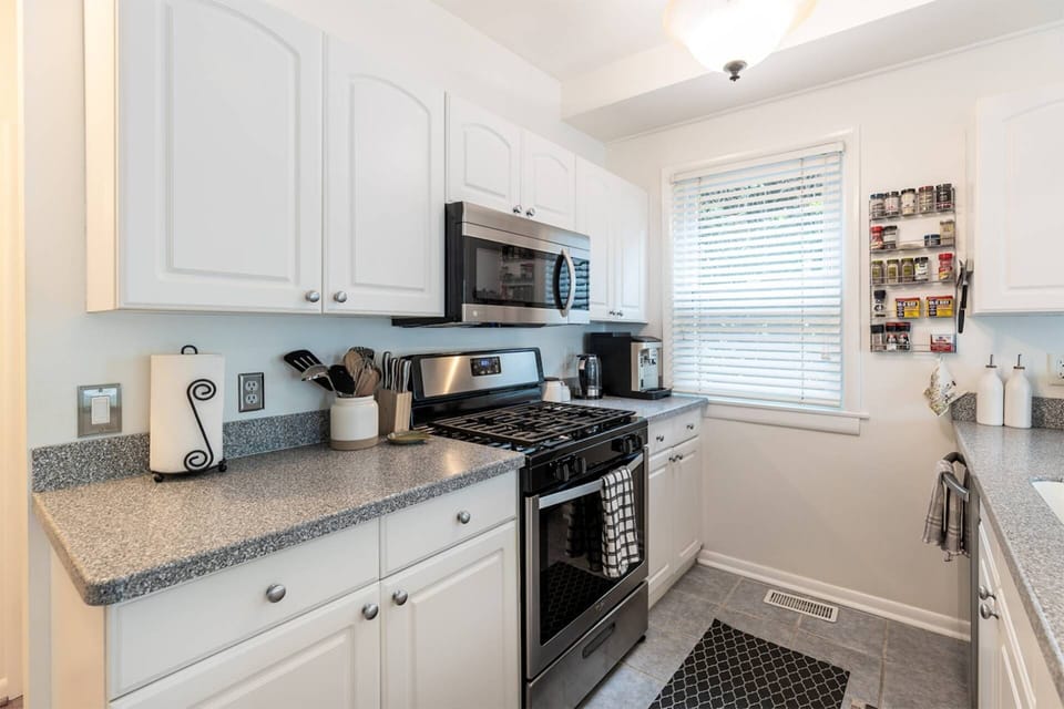 The kitchen is equipped with both main and small appliances.