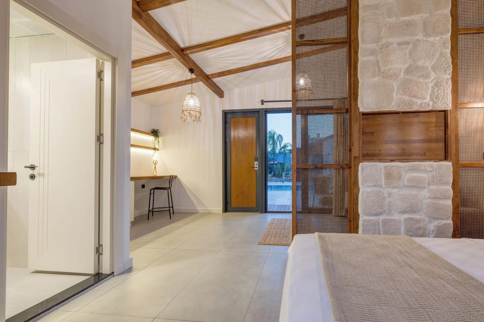 Junior Suite, Pool View | Hypo-allergenic bedding available, down comforters, minibar, desk