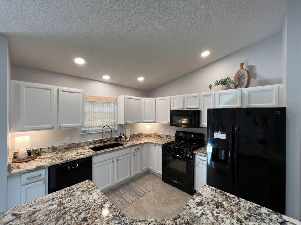 The Updated and clean kitchen is ready for any meal. 