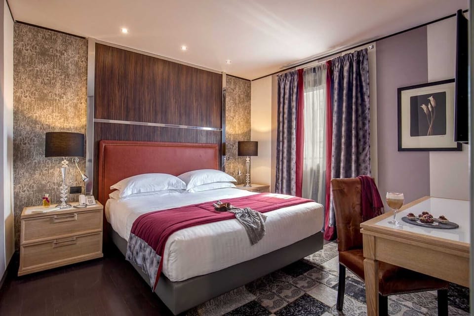Down comforters, memory foam beds, in-room safe, desk