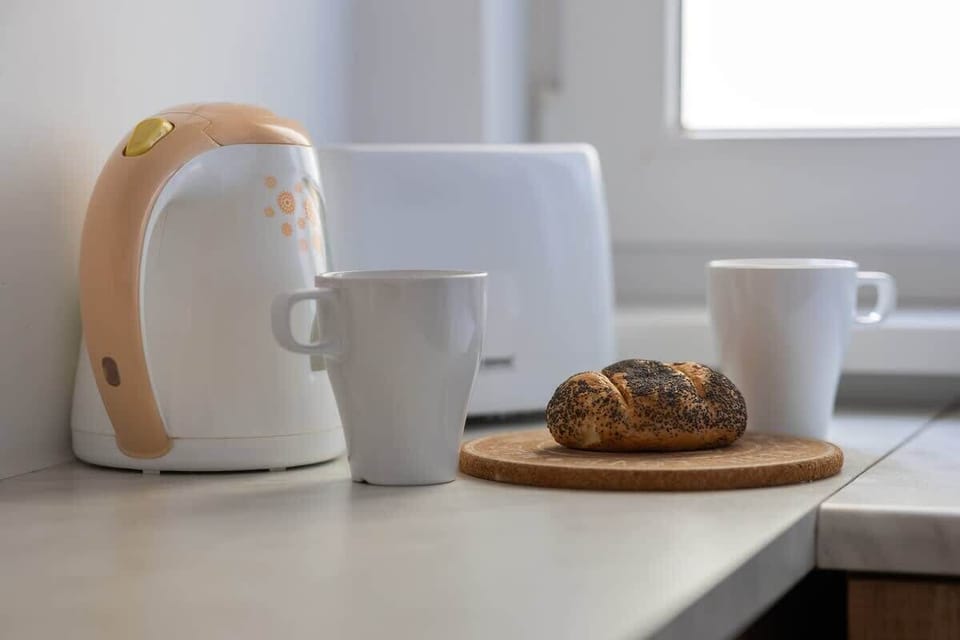 A close-up of a tea set and breakfast setup on a table. Great for a quiet morning moment.