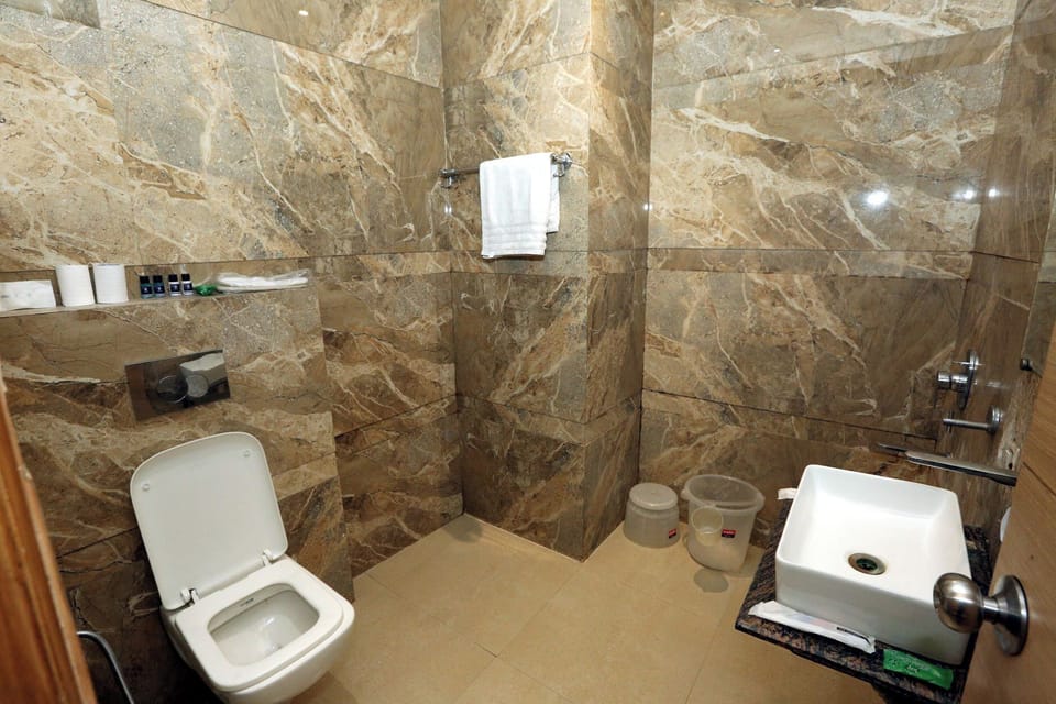 Deluxe Double Room, City View | Bathroom | Shower, hair dryer, slippers, towels