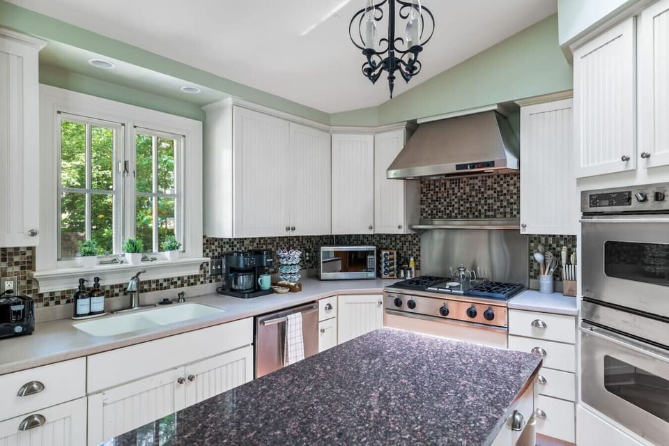 View of our full size kitchen that offers tons of natural sunlight. We provide a complimentary coffee station to start your morning off on the right foot :)