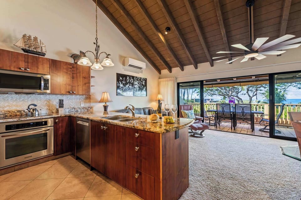 Cook, relax, and soak in the views! Our open-concept kitchen flows right out to your incredible lanai. 