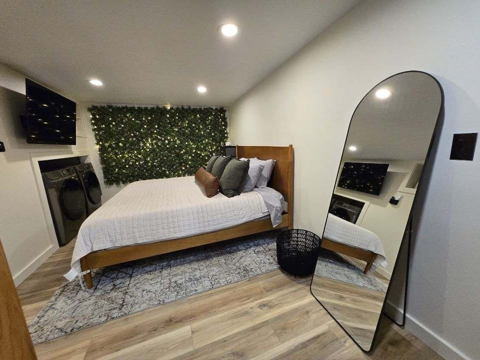 Master Bedroom with King Bed, 42-inch Smart TV, sound machine, blackout curtains and desk with computer monitor.   Full size washer/dryer with detergent provided.