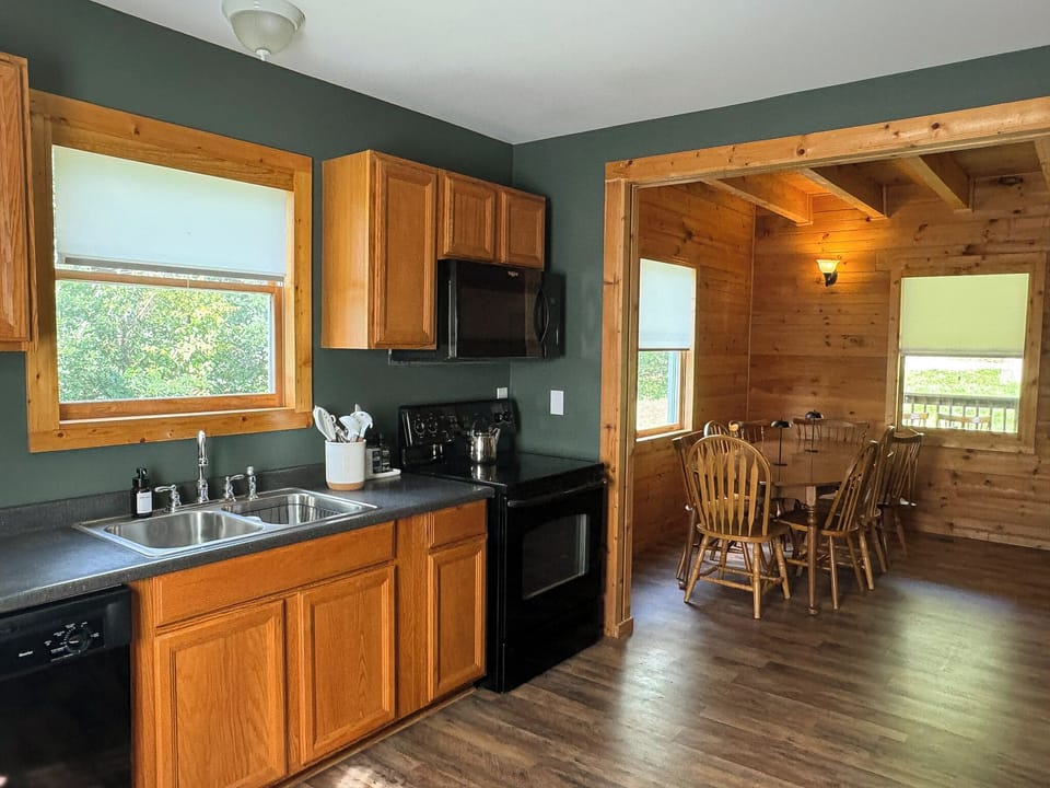 Kitchen with dining table view. Table seats 8 