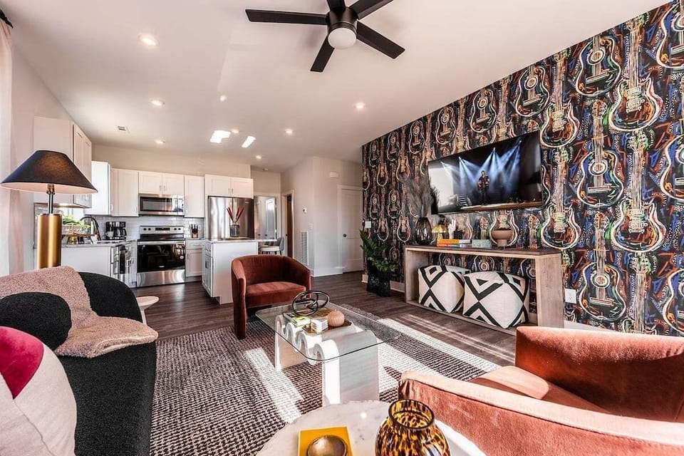 Unit 232: Open concept living area with TV