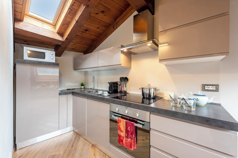 Family Apartment, Multiple Bedrooms, 2 Bathrooms (Appartamento 3 Camere Letto) | Private kitchen | Fridge, microwave, oven, stovetop