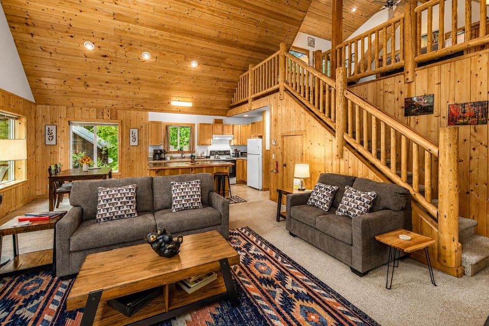 Open Concept-stairs lead up to open loft sleeping space with king bed