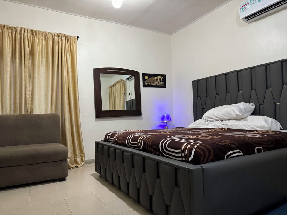 Desk, laptop workspace, bed sheets