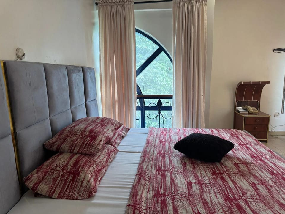 Desk, laptop workspace, bed sheets