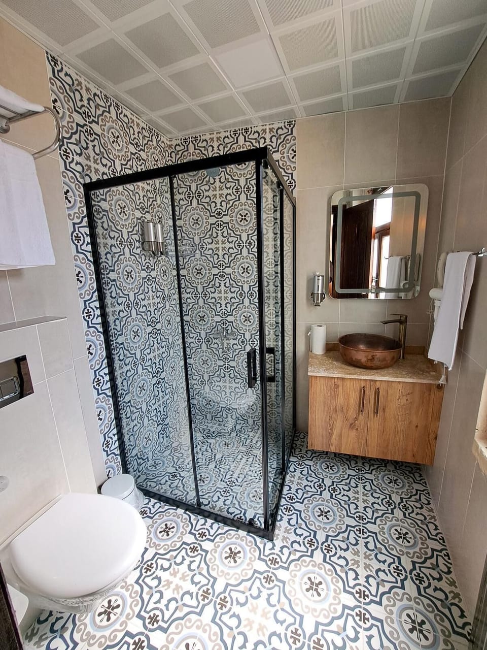 Shower, hair dryer, slippers, towels