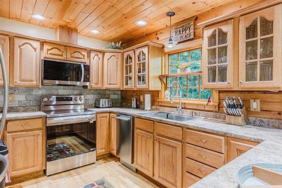 Spacious kitchen with stainless steel appliances, granite countertops, and plenty of cabinet storage for home-style cooking in Bryson City.