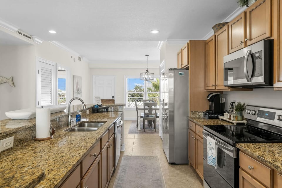 Your fully equipped galley kitchen features granite countertops, stainless appliances, and everything you need to prepare memorable meals during your stay.