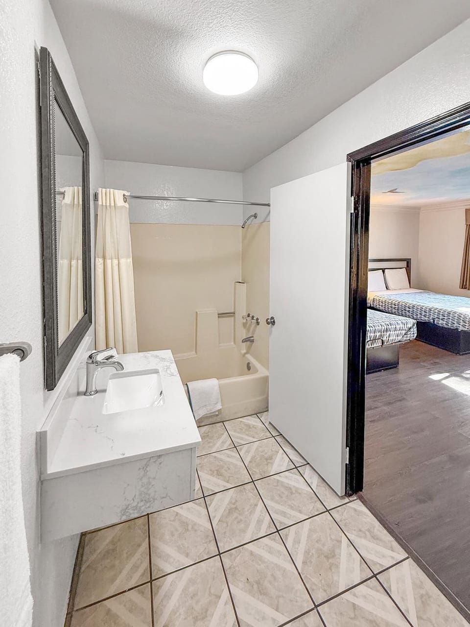 Standard Double Room, 2 Queen Beds | Bathroom | Bathtub, free toiletries, towels, soap