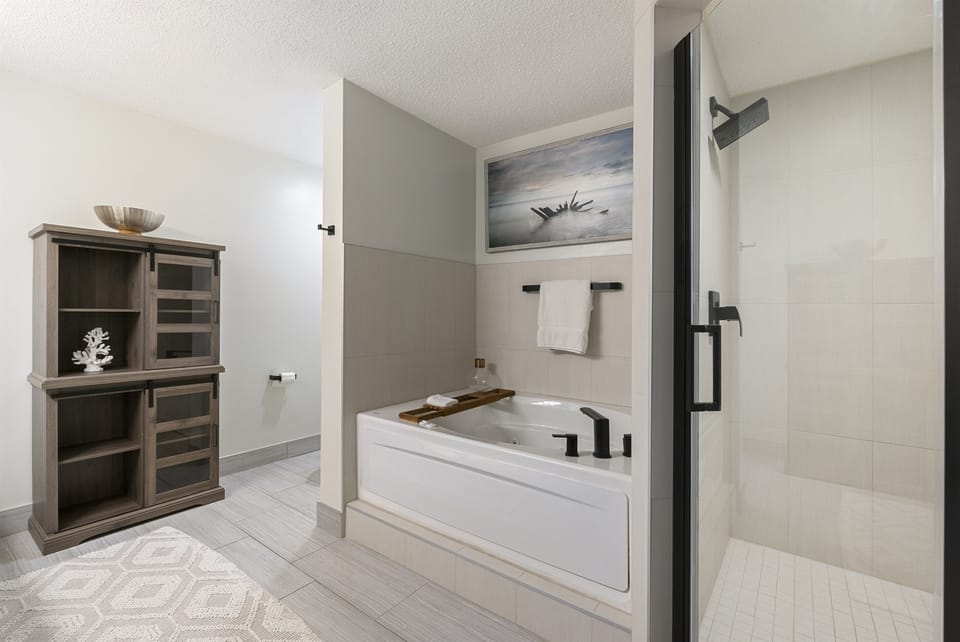 Master Bathroom has walk-in shower as well as soak in tub with jets
