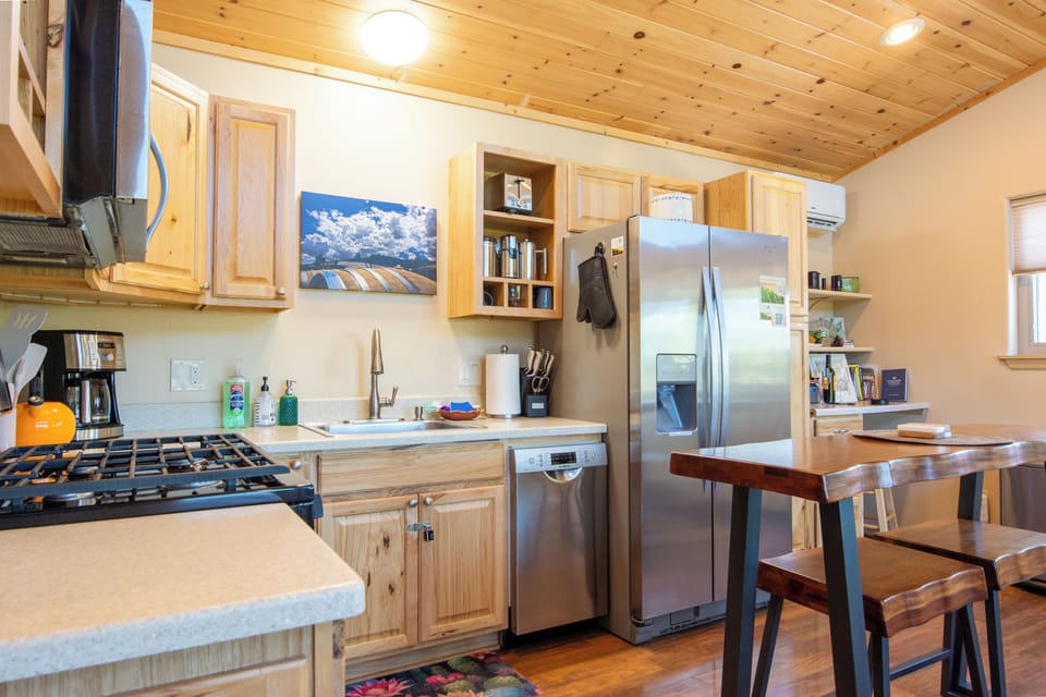 Fully stocked kitchen with oil, spices, and cookware
