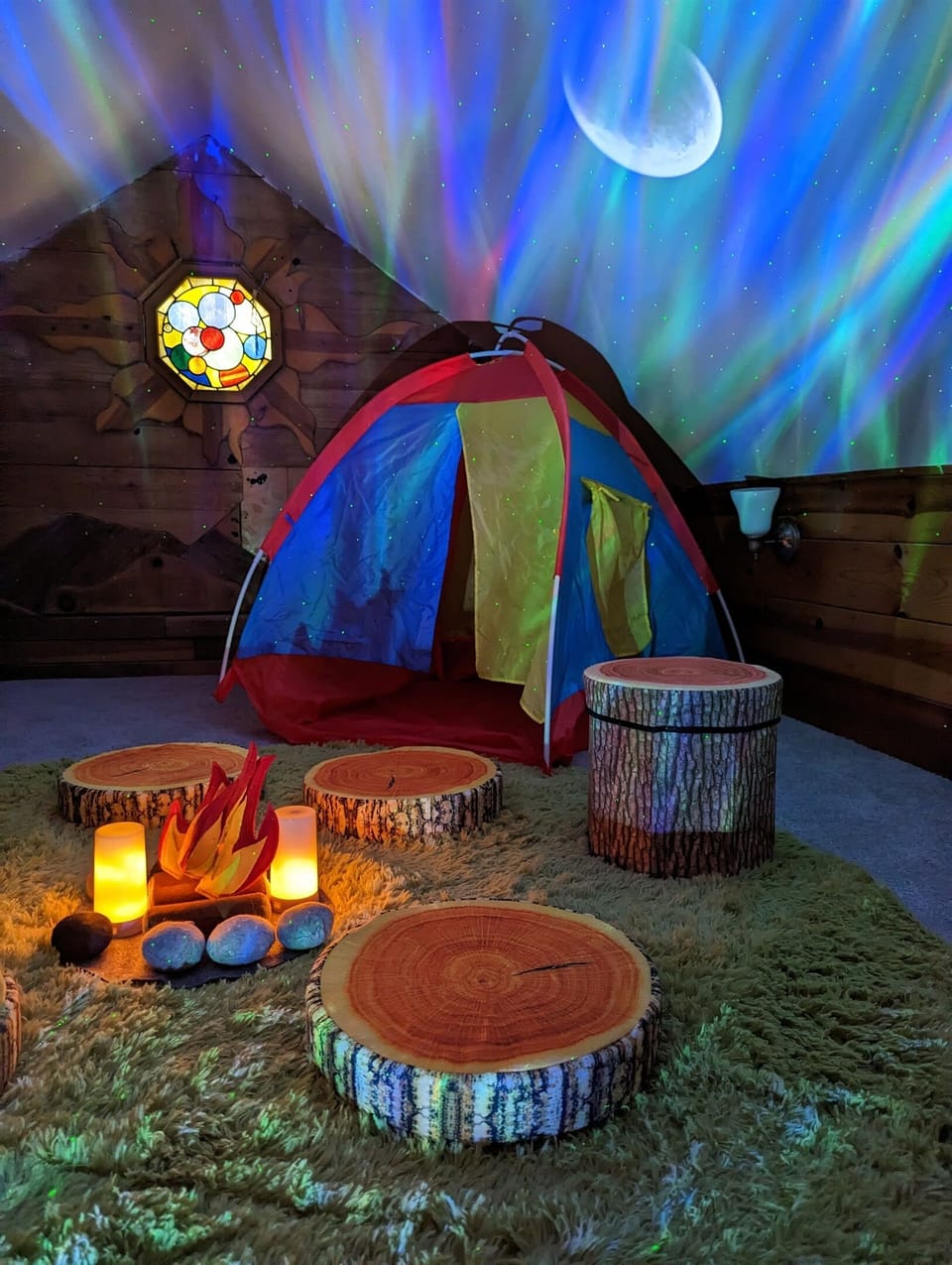 The camping area in the back of the upstairs play area has a teepee and make believe campfire hangout spot.