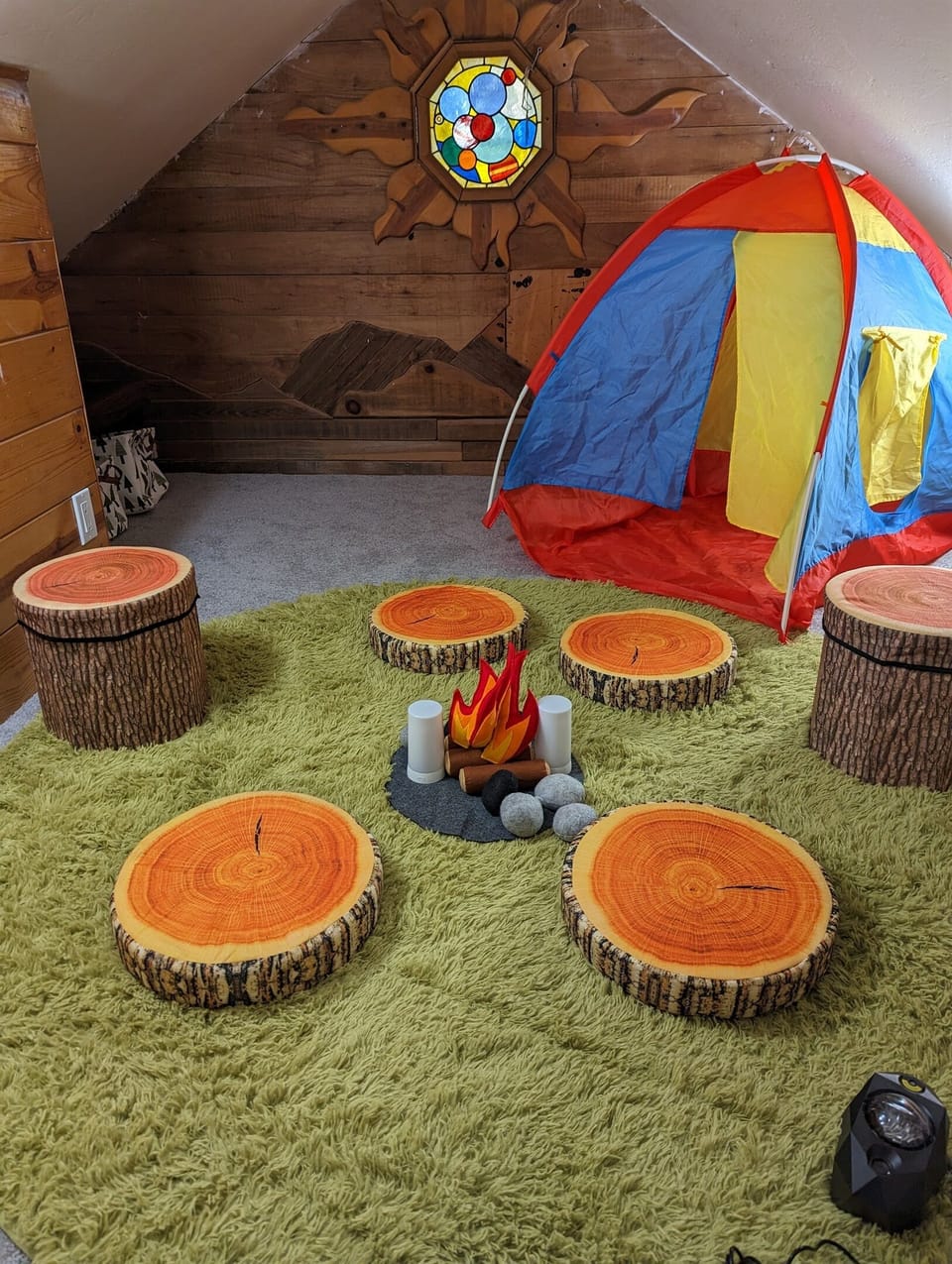 The upstairs, kids only area has a teepee and make believe campfire area as well as other toys for the little ones.