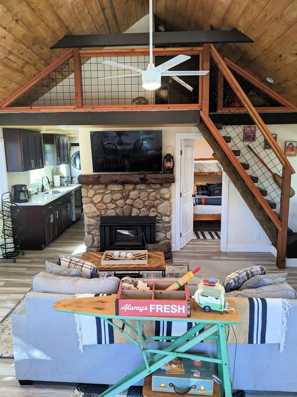 Stairs from the main living area of the main cabin lead up to the kid friendly second story play area.