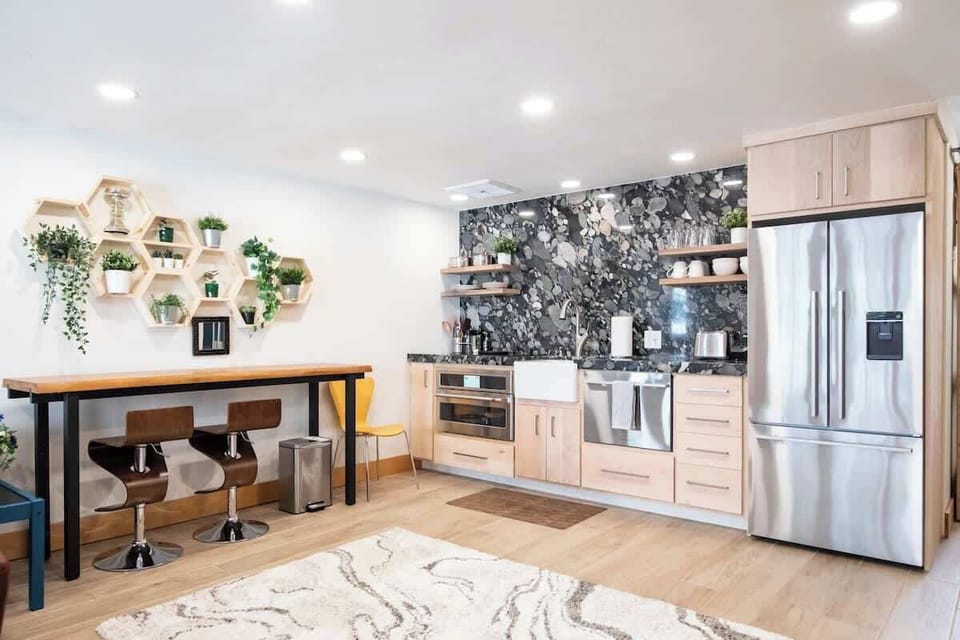 Efficient kitchen has everything.  That is Brazilian river bottom granite and custom Maple.